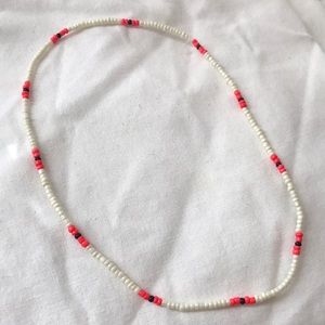 Red and cream seed bead necklace.
